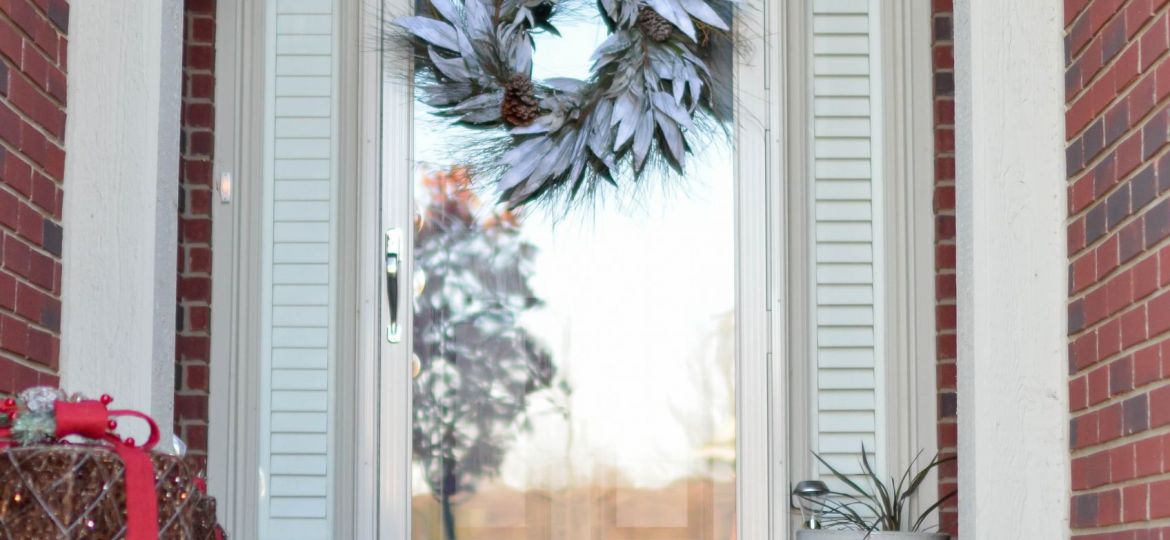 Pile of gifts in front of a door.