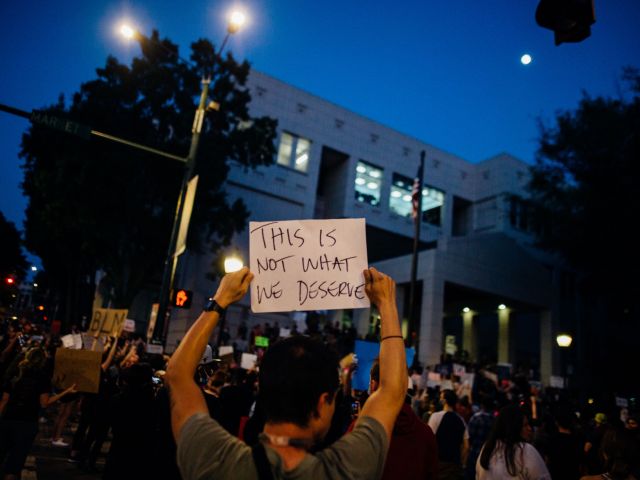 protesters-holding-signs-4552838